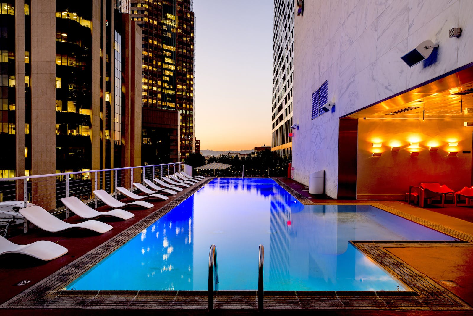 White Sunloungers Beside Pool