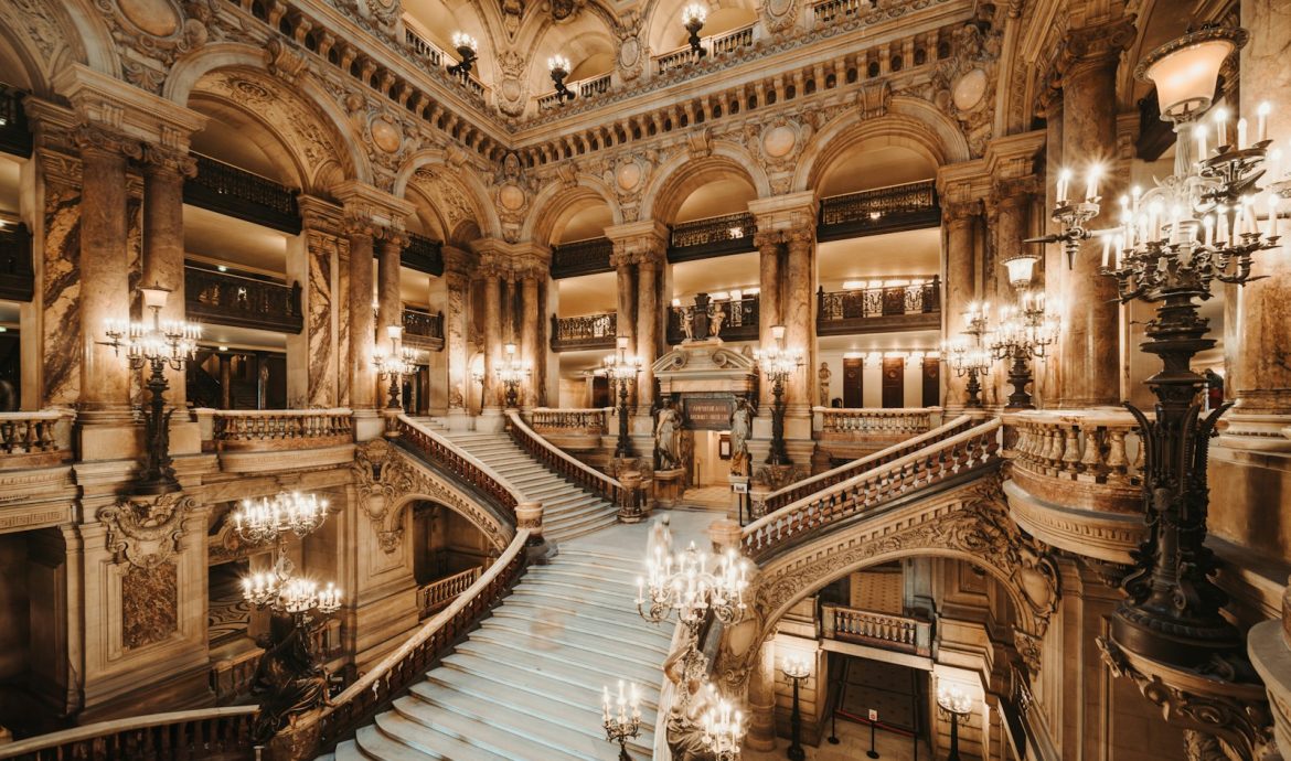 a grand staircase with chandeliers and chandeliers