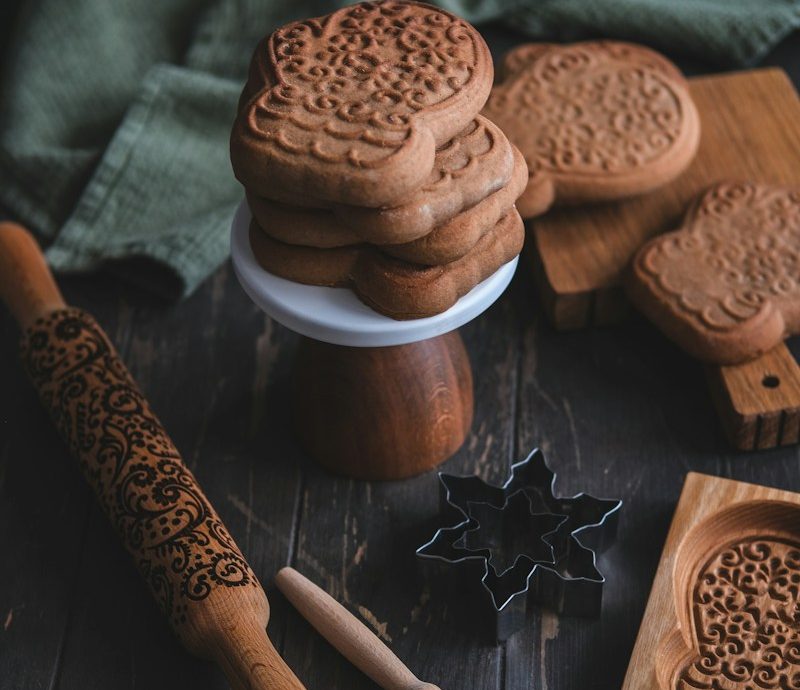 a table topped with cookies and cookies cutters