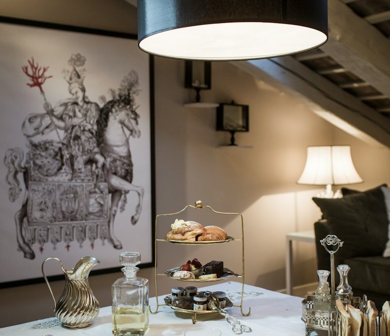 a white table topped with plates of food and drinks